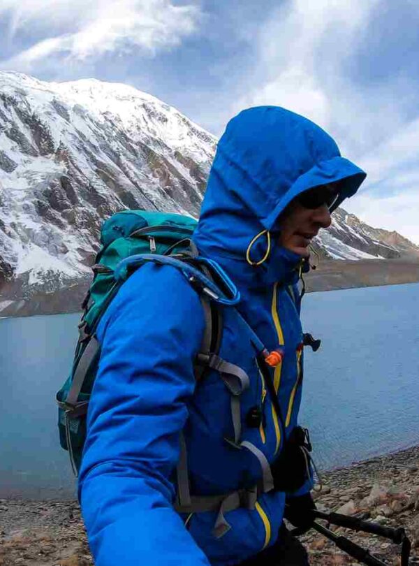 A man taking a sefie at the shore of Tilicho lake in Himalayas